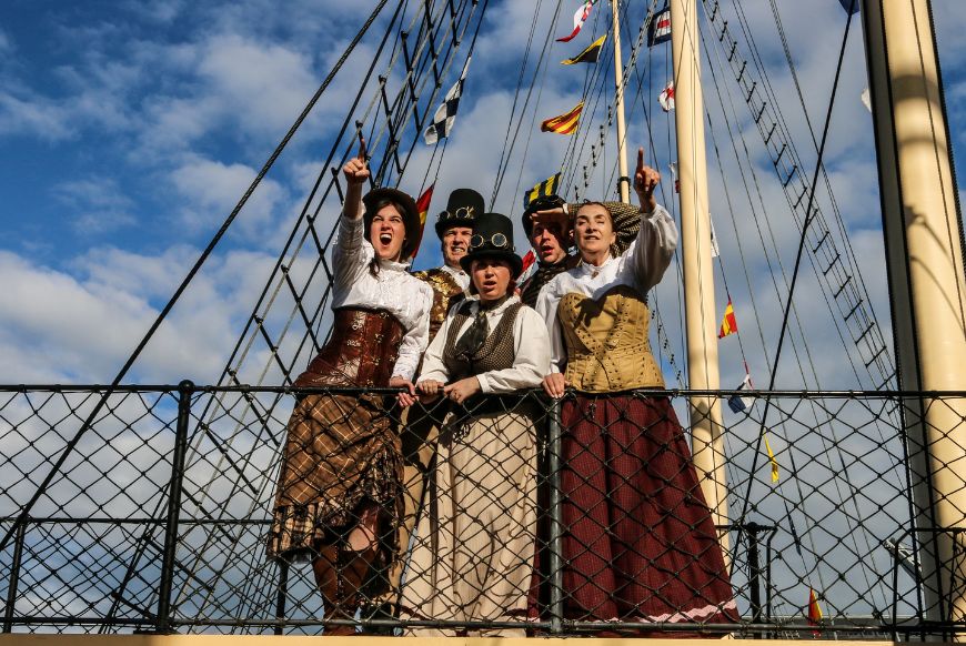 5 actors in steam punk gear on the ss grate britain